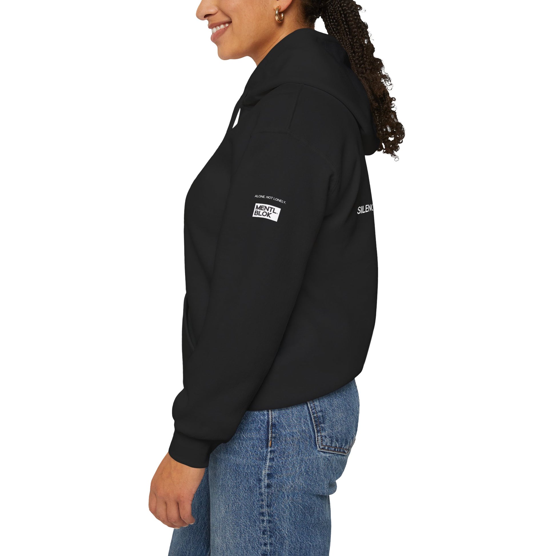Person wearing a black hoodie with visible branding on a white background