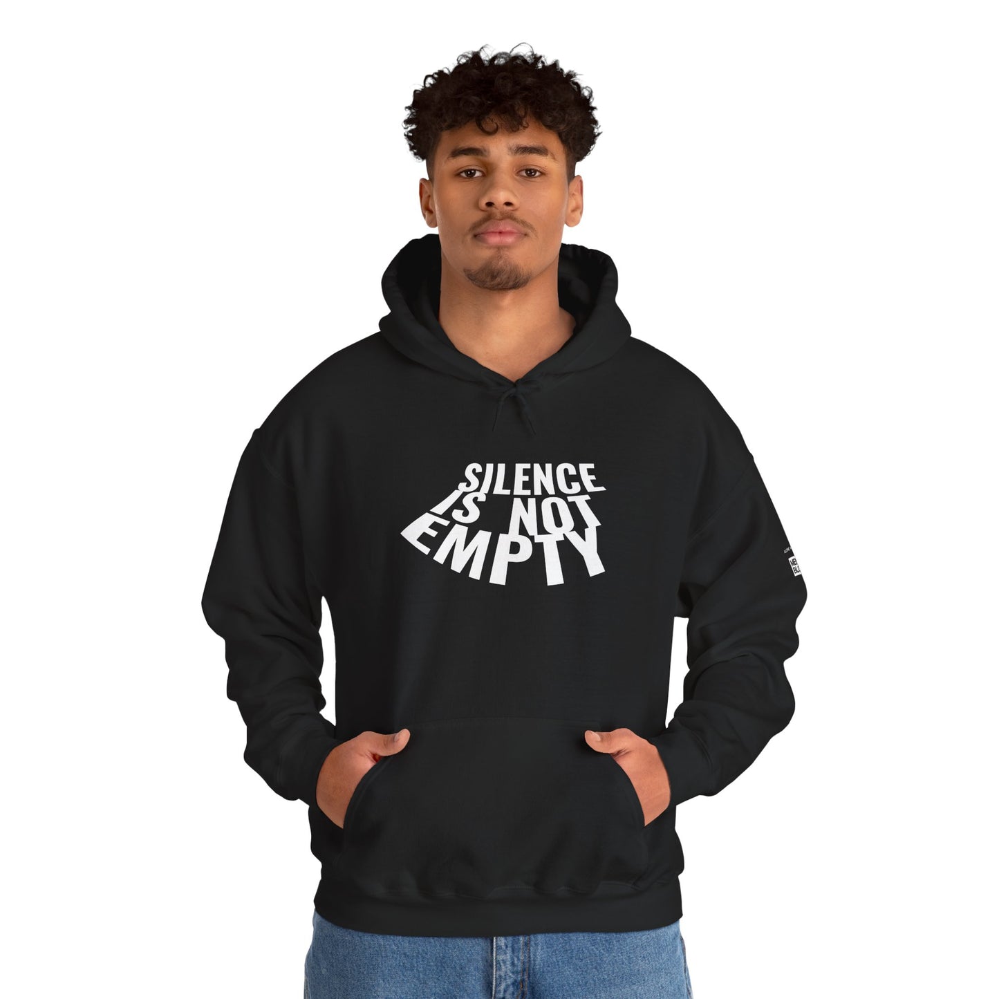 Person wearing a black hoodie with 'Silence is Not Empty' text on a white background